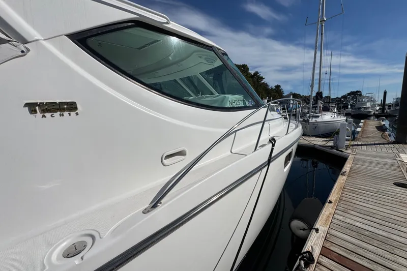 Slide: The Image of 2008 Tiara Yachts 3900 Sovran docked at marina under clear blue sky. - 71
