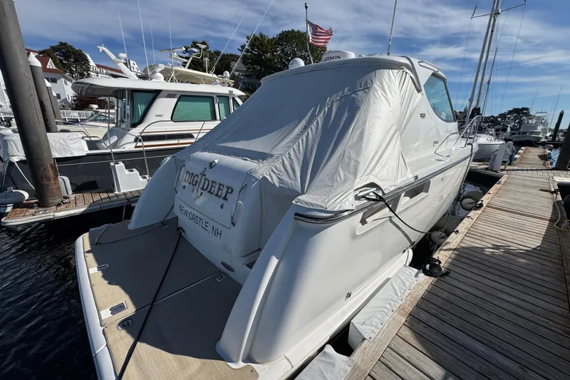 Slide: The Image of 2008 Tiara Yachts 3900 Sovran docked, covered, with American flag in background. - 9