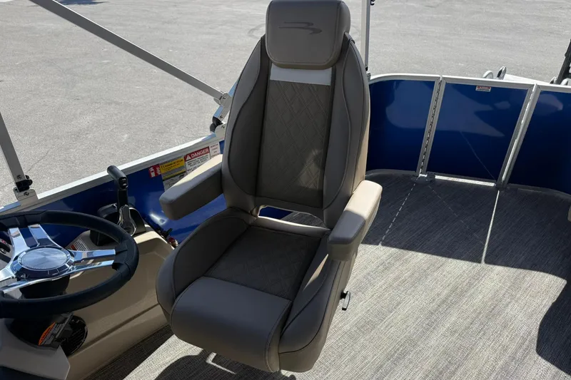 Slide: The Image of Captain's chair and steering wheel of 2026 Bennington S 21 SL pontoon boat. - 12