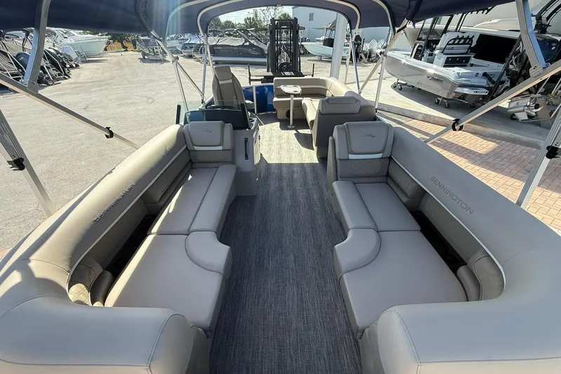 Slide: The Image of 2026 Bennington S 21 SL pontoon boat interior with spacious seating and canopy. - 6