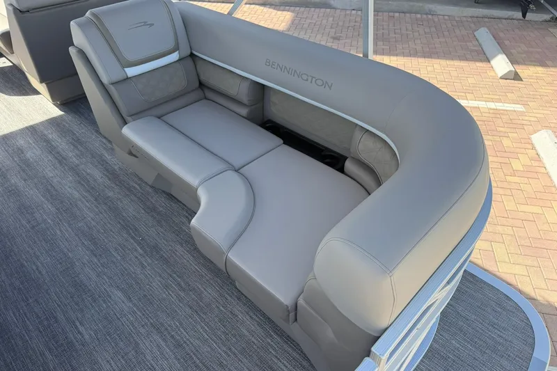 Slide: The Image of 2026 Bennington S 21 SL boat interior with luxurious gray seating. - 8