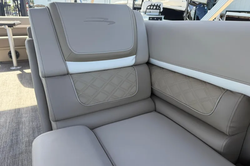 Slide: The Image of 2026 Bennington S 21 SL boat interior with luxurious beige seating. - 9