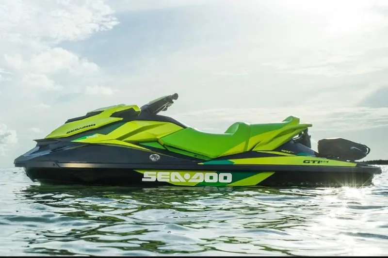 Slide: The Image of Manufacturer Provided Image: 2019 Sea-Doo GTI SE 155 jet ski on water, vibrant green and black design. - 6