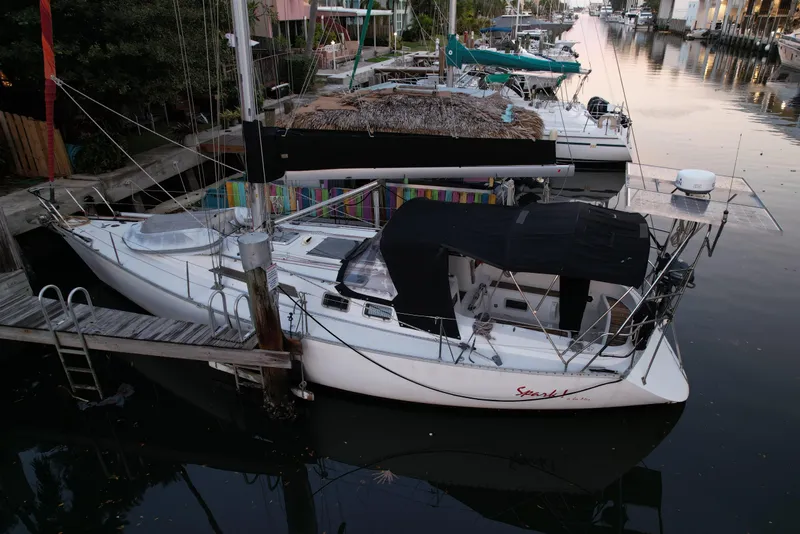 The Image of 1989 Canadian Sailcraft CS40 sailboat docked in a calm marina. - 0