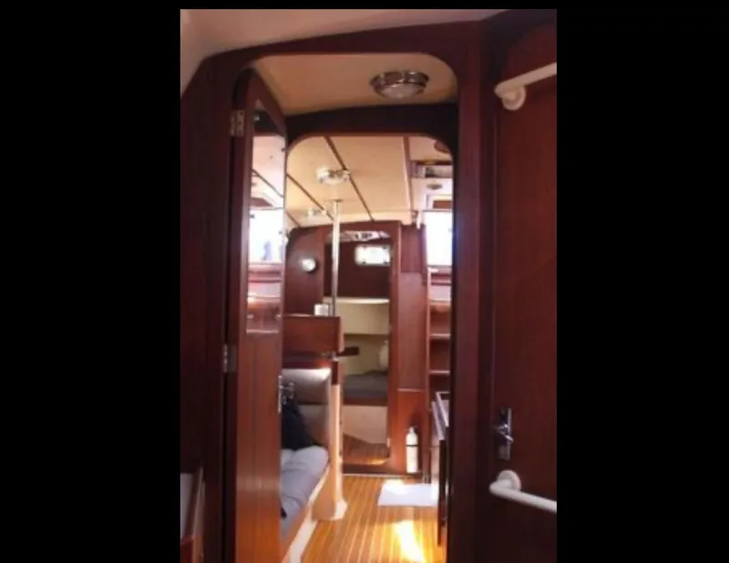 Slide: The Image of 1989 Canadian Sailcraft CS40 yacht interior with wooden finish and cozy cabin layout. - 15