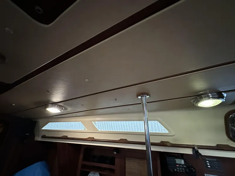 Slide: The Image of Interior of 1989 Canadian Sailcraft CS40 sailboat with ceiling lights and windows. - 26
