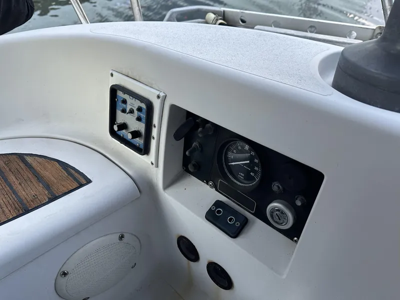 Slide: The Image of 1989 Canadian Sailcraft CS40 cockpit controls with gauges and speaker. - 38