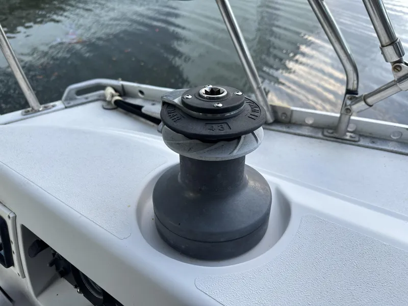 Slide: The Image of 1989 Canadian Sailcraft CS40 sailboat winch on deck by water. - 39
