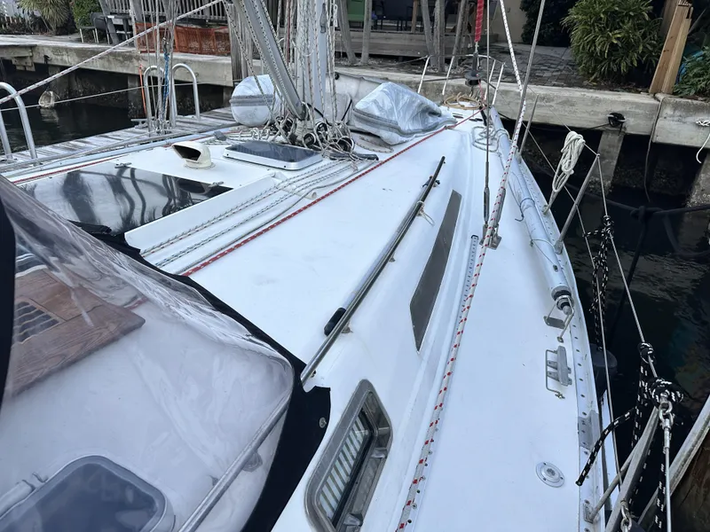 Slide: The Image of 1989 Canadian Sailcraft CS40 sailboat deck with rigging and dockside view. - 48