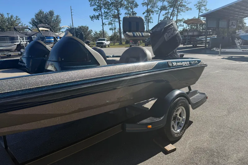 Slide: The Image of 2002 Ranger 185 VS boat on trailer in outdoor storage area. - 3
