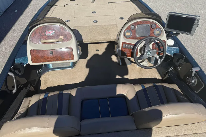 Slide: The Image of 2002 Ranger 185 VS boat interior with dual consoles and steering wheel. - 4