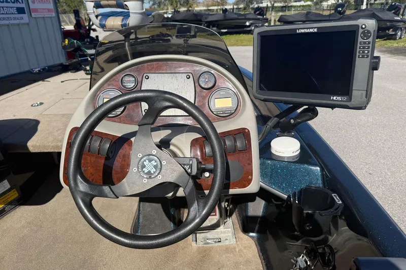 Slide: The Image of 2002 Ranger 185 VS boat dashboard with steering wheel and Lowrance HDS-12 fishfinder. - 5