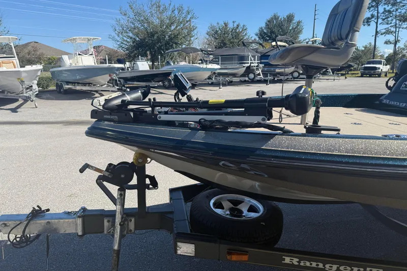 Slide: The Image of 2002 Ranger 185 VS boat on trailer with Minn Kota trolling motor in a marina. - 6