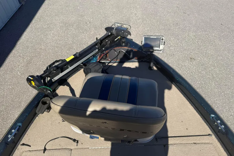 Slide: The Image of 2002 Ranger 185 VS boat interior with seat, trolling motor, and fish finder. - 8