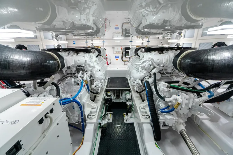 Slide: The Image of Engine room of 2026 Viking 54 Convertible yacht, showcasing advanced machinery and clean design. - 10