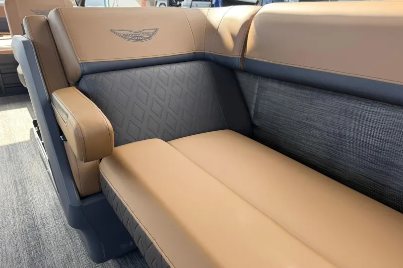 Slide: The Image of 2026 Bennington 26 M Swingback boat interior with luxurious tan and gray seating. - 11