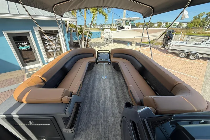 Slide: The Image of 2026 Bennington 26 M Swingback pontoon boat with spacious seating and modern design. - 13