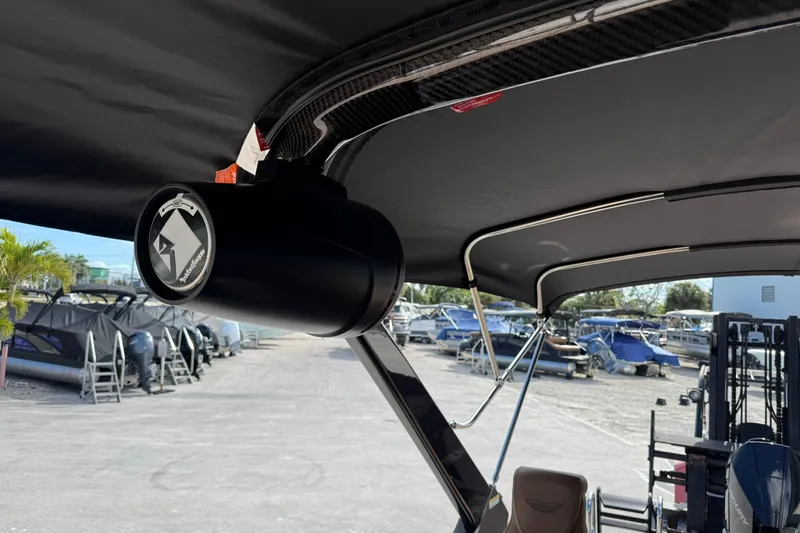 Slide: The Image of 2026 Bennington 26 M Swingback boat with Rockford Fosgate speaker, docked at marina. - 17
