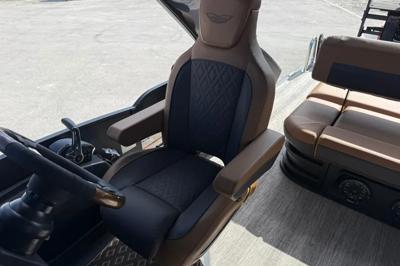 Slide: The Image of 2026 Bennington 26 M Swingback boat interior with luxurious seating and steering wheel. - 20