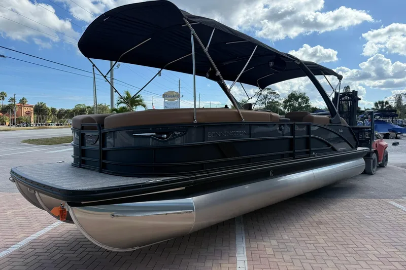 Slide: The Image of 2026 Bennington 26 M Swingback pontoon boat with canopy on a trailer. - 5