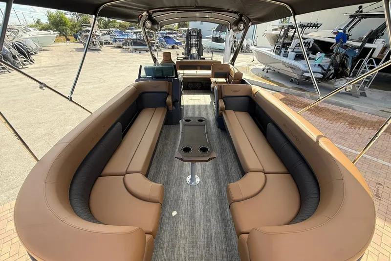 Slide: The Image of Luxurious 2026 Bennington 26 M Swingback pontoon boat with spacious seating and modern design. - 8