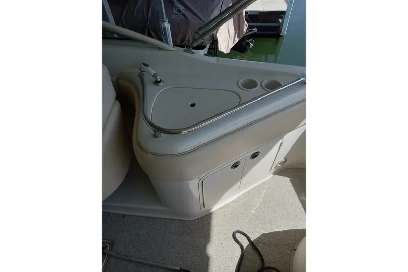 Slide: The Image of 2001 Sea Ray 240 Sundeck interior with sink and storage compartments. - 3
