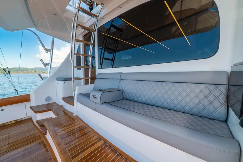 Slide: The Image of Luxury seating area on 2026 Viking 64 Convertible yacht with ocean view. - 27