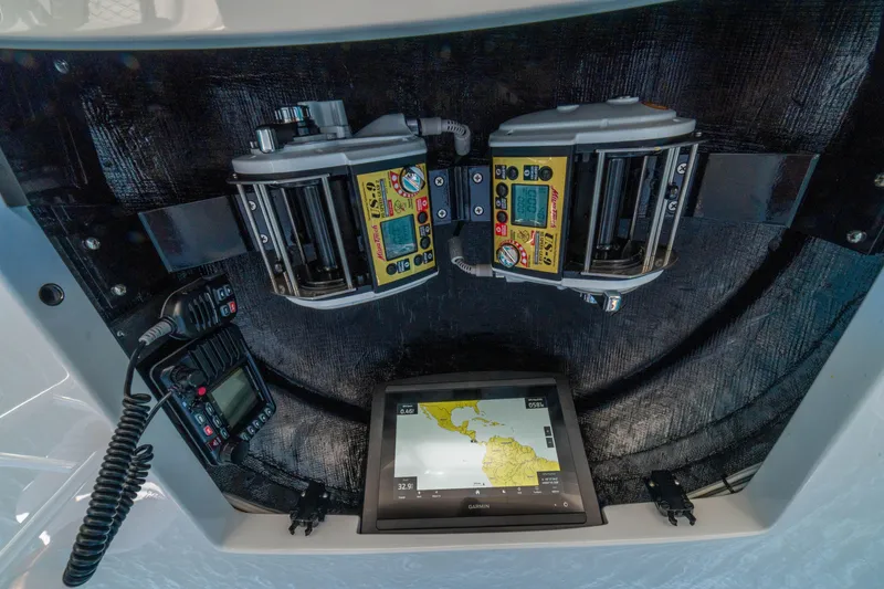 Slide: The Image of Control panel of 2026 Viking 64 Convertible yacht with navigation and communication systems. - 35