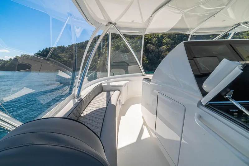 Slide: The Image of Luxurious interior of 2026 Viking 64 Convertible yacht with scenic ocean view. - 37