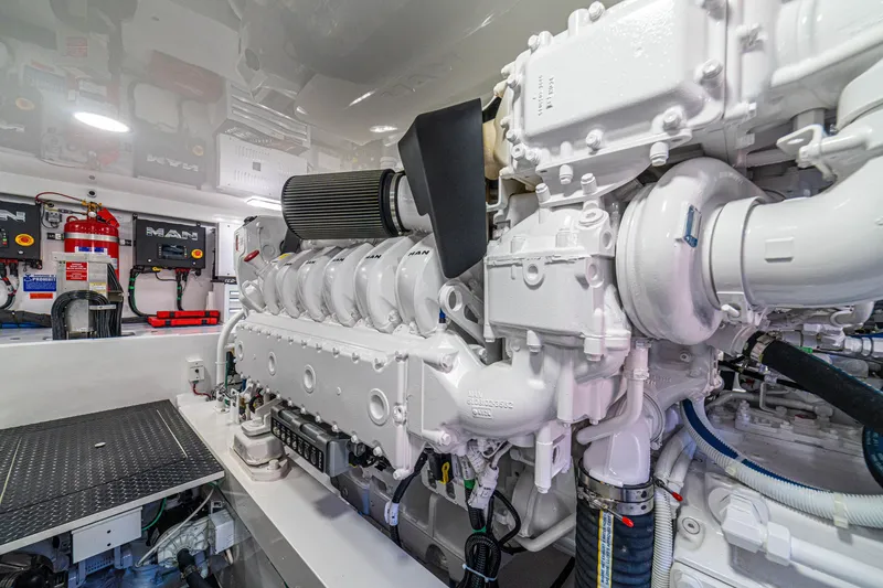 Slide: The Image of Engine room of 2026 Viking 64 Convertible yacht, featuring advanced machinery and equipment. - 47