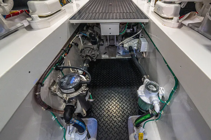 Slide: The Image of Engine room of 2026 Viking 64 Convertible yacht, showcasing advanced mechanical systems. - 48