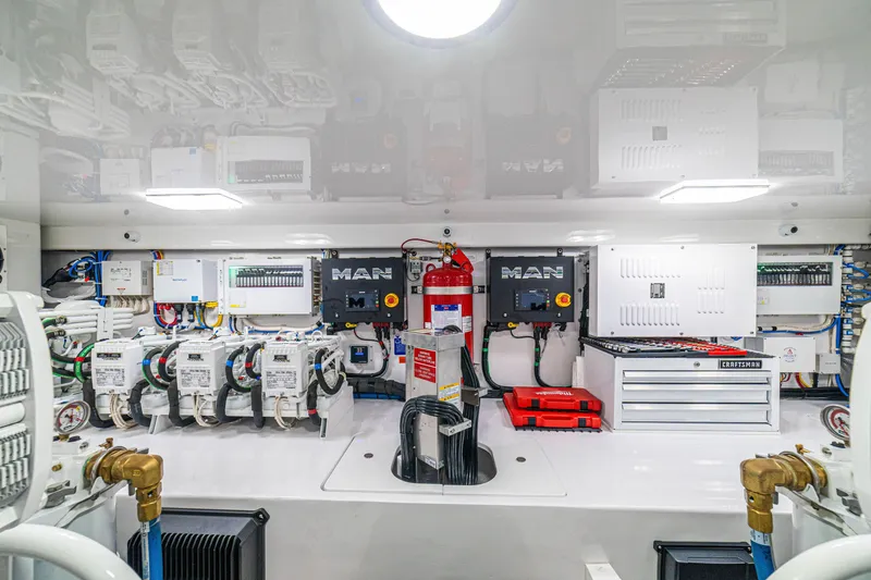 Slide: The Image of Engine room of 2026 Viking 64 Convertible yacht, featuring advanced machinery and equipment. - 49