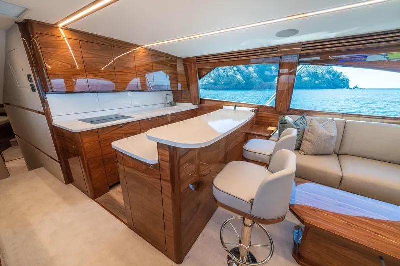 Slide: The Image of Luxurious interior of 2026 Viking 64 Convertible yacht with elegant wood finishes and ocean view. - 6