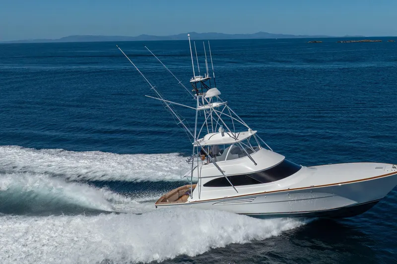 Slide: The Image of 2026 Viking 64 Convertible yacht cruising on open ocean waters. - 61