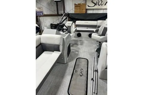Slide: The Image of 2023 Harris Cruiser 230 interior with modern seating and sleek design in a showroom. - 20