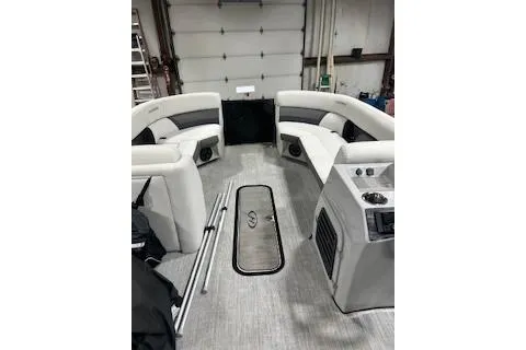 Slide: The Image of 2023 Harris Cruiser 230 interior with spacious seating and modern design. - 21