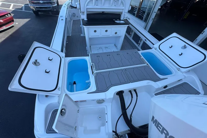 Slide: The Image of 2024 Crevalle 26 HCO boat interior with storage compartments and seating. - 10