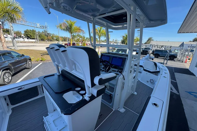 Slide: The Image of 2024 Crevalle 26 HCO boat interior with helm, seating, and navigation displays. - 16