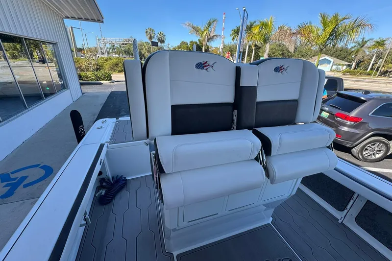 Slide: The Image of 2024 Crevalle 26 HCO boat interior with dual seats and sleek design. - 17