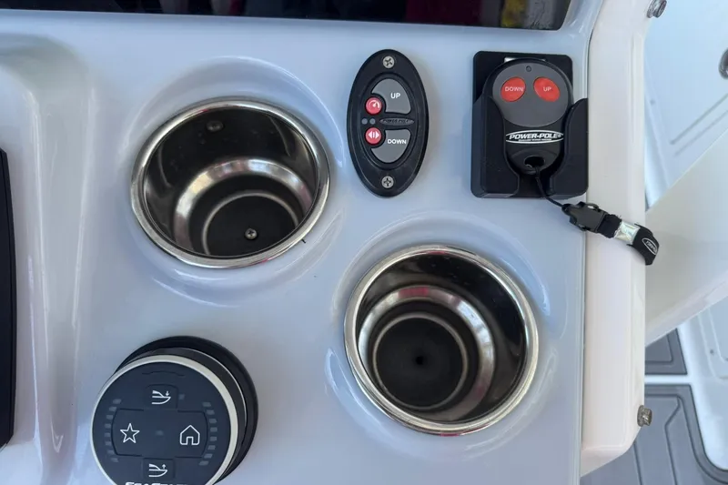 Slide: The Image of Control panel of 2024 Crevalle 26 HCO boat with cup holders and Power-Pole controls. - 22