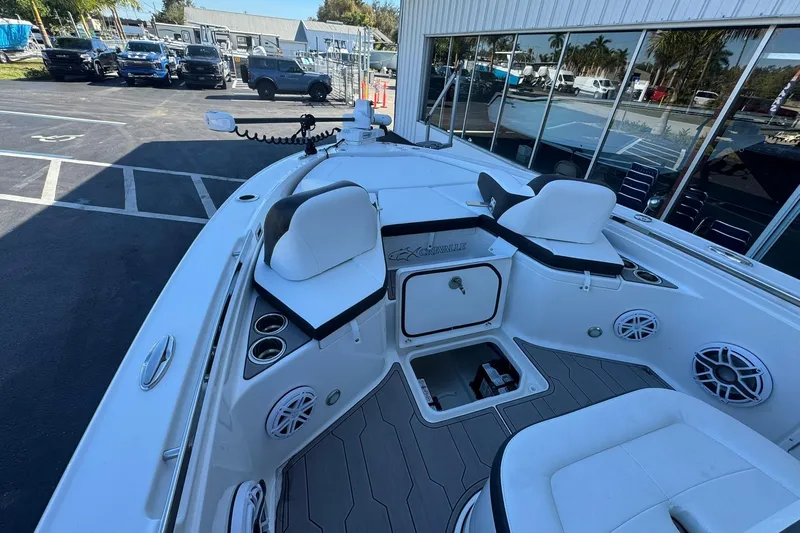 Slide: The Image of 2024 Crevalle 26 HCO boat interior with seating and storage compartments. - 33