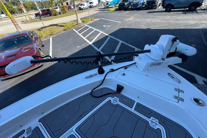 Slide: The Image of 2024 Crevalle 26 HCO boat with Minn Kota trolling motor in parking lot. - 41