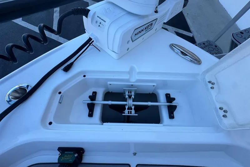 Slide: The Image of 2024 Crevalle 26 HCO boat with Minn Kota trolling motor and storage compartment. - 42