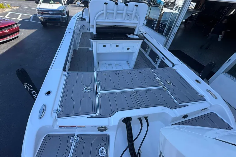 Slide: The Image of 2024 Crevalle 26 HCO boat with spacious deck and seating area. - 9