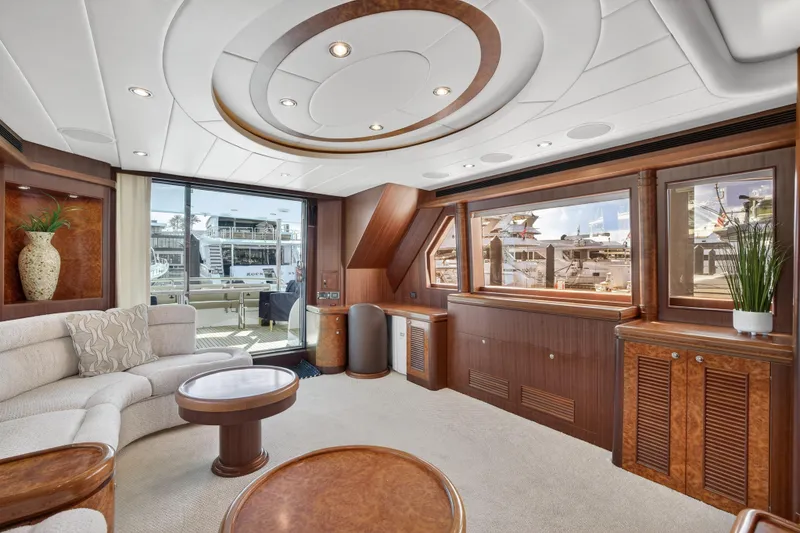 Slide: The Image of Luxurious 2009 Horizon Flybridge yacht interior with elegant wood finishes and plush seating. - 14