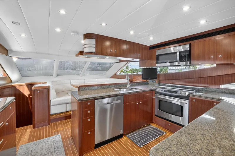 Slide: The Image of Luxurious 2009 Horizon Flybridge yacht interior with modern kitchen and seating area. - 17