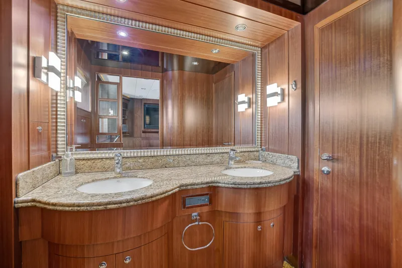 Slide: The Image of Luxurious wooden bathroom interior on 2009 Horizon Flybridge yacht with dual sinks and granite countertop. - 23