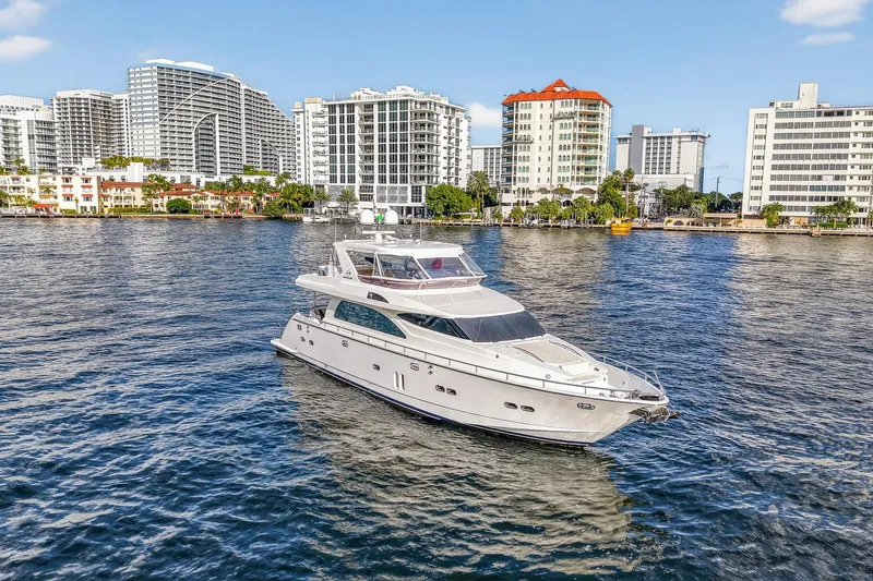 Slide: The Image of 2009 Horizon Flybridge yacht cruising near urban waterfront skyline. - 3