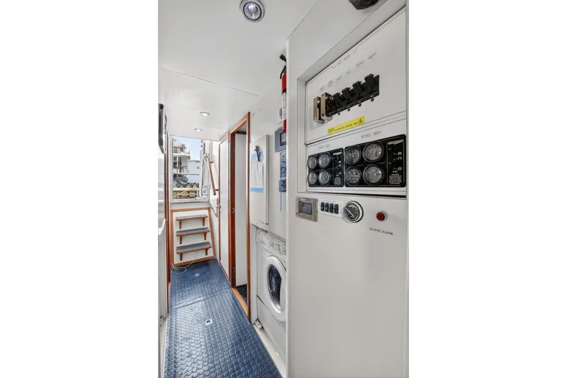 Slide: The Image of 2009 Horizon Flybridge yacht interior with control panel and laundry area. - 30