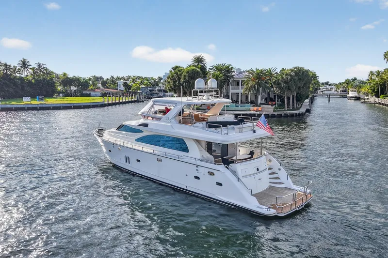 Slide: The Image of Luxurious 2009 Horizon Flybridge yacht cruising on a scenic waterway. - 4